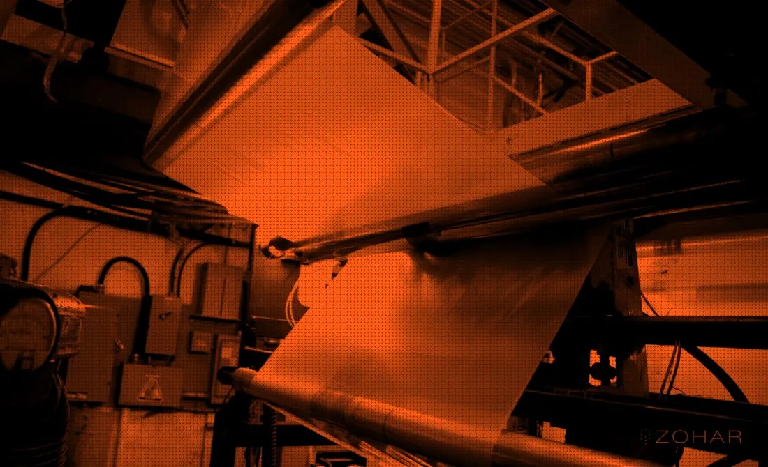 Film coming off the line, in orange and black